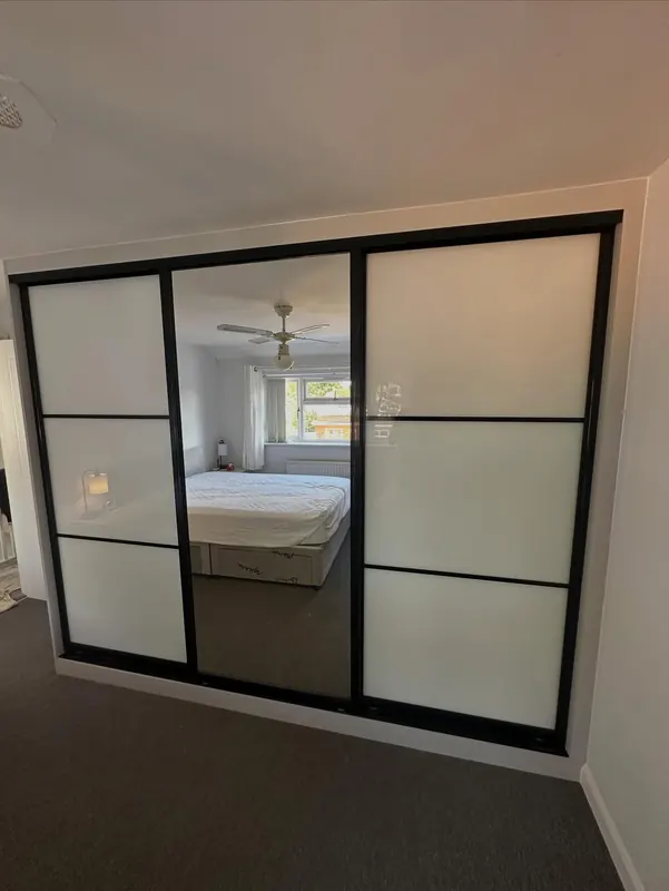Sliding wardrobe doors with mirror and frosted panels