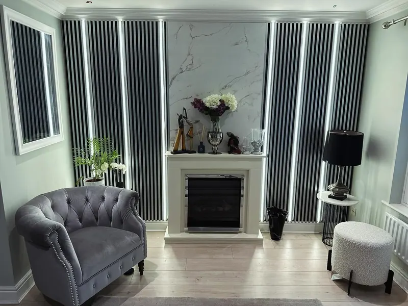 Living room with a slatted feature wall, fireplace and shelving