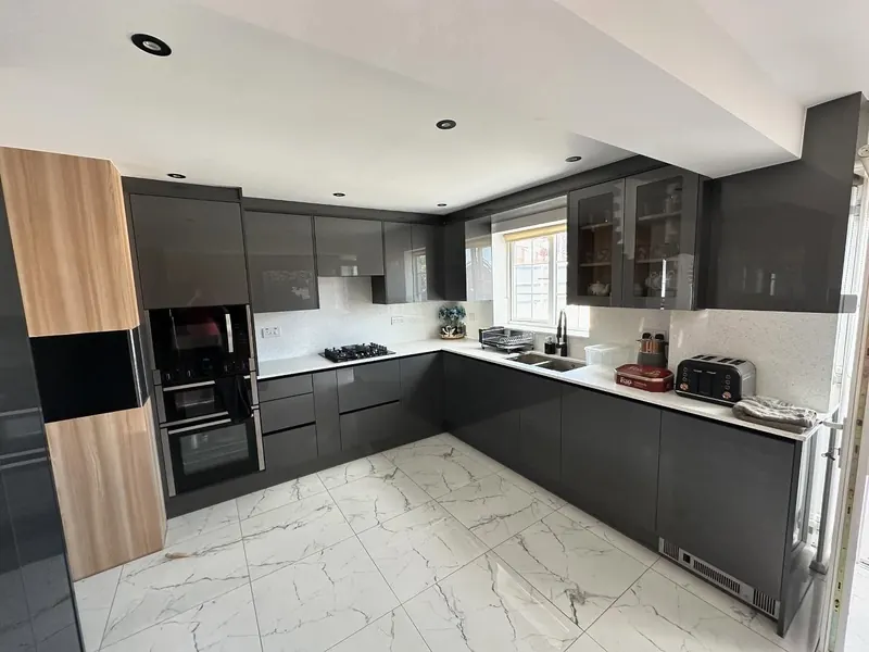 Grey and oak fitted kitchen with a marble effect floor